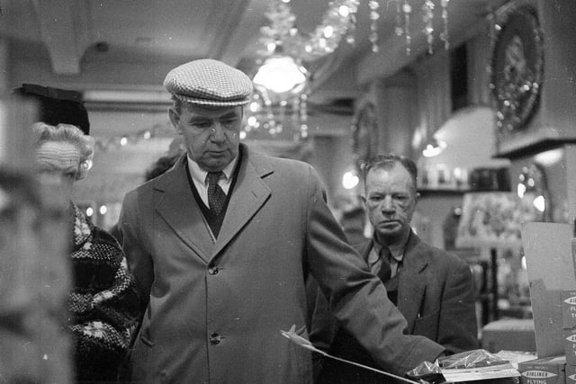 Two men 'enjoying' their Christmas shopping at Edinburgh's Expressions department store in 1962.