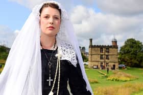 A costumed re-enactor playing Mary Queen of Scots, pictured outside Sheffield Manor Lodge in 2019