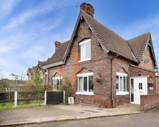 The appealing frontage of the 19th century cottage that is for sale at £140,000.