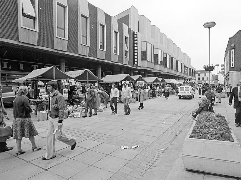 A bustling West Gate, showing the old Littlewoods shop and an abundance of market stalls.