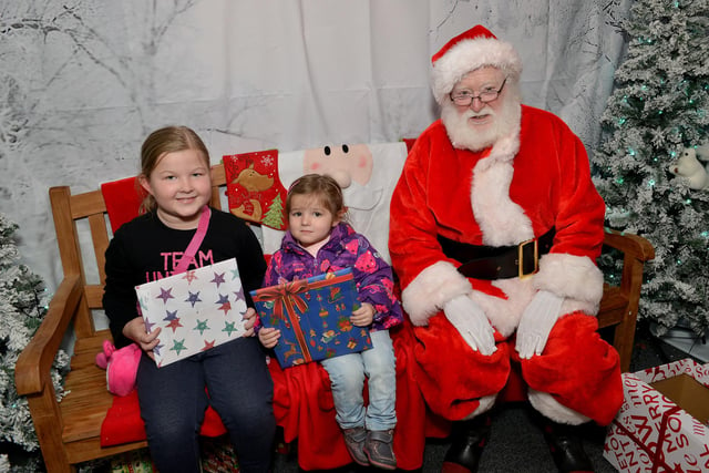 Chesterfield Christmas lights switch on, pictured meeting Santa are Lily Overton, seven and Poppy Overton, two in 2018