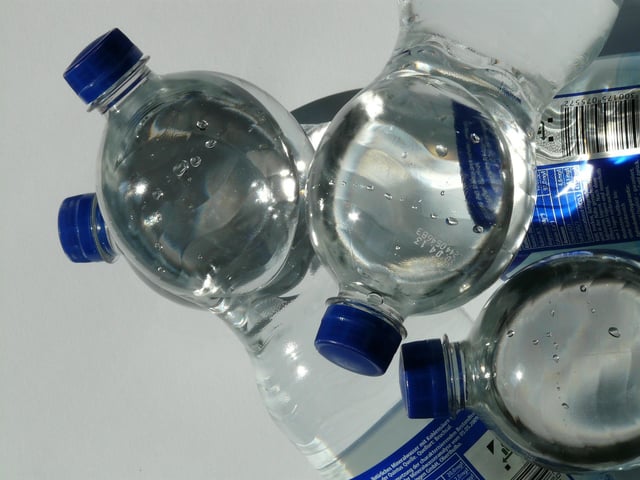 B&Q suggest poking holes into plastic bottles and bury it in a plant pot and then fill. You can also get the same effect by filling up an empty wine bottle and burying it upside with the neck in the soil.
