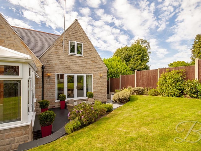 The back garden features a patio seating area.