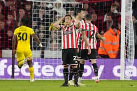 Ben Osborn of Sheffield Utd and Anel Ahmedhodzic look dejected following Ben Wiles' goal for Rotherham: Andrew Yates / Sportimage