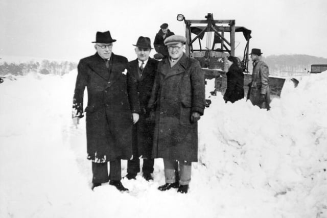 Officials observing snow clearing in 1947