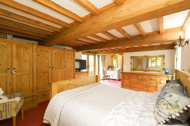 The master bedroom is located on the ground floor, with the other bedrooms shared over two sections of the first floor.