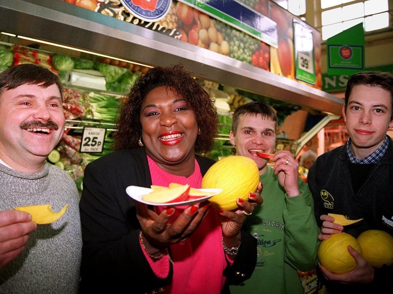 Rustie Lee hands out mango and melon at Sheffield's Castle Market in 1996 to support the campaign to save the independent greengrocer. With her are Martyn and Ian Bingham, of Bingham greengrocers. and Jason Gath/