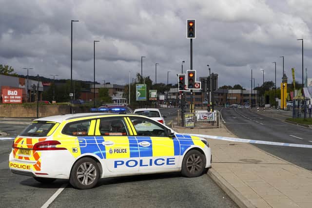 Penistone Road, Hillsborough remains closed this afternoon (Thursday, September 29) following a crime spree on the road last night in which two cars were stolen and four people, including two special constables, were left injured. Picture: Scott Merrylees
