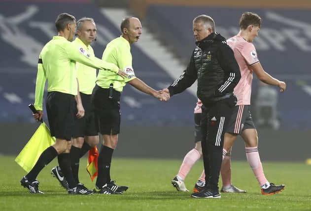 Sheffield United's manager Chris Wilder shakes hands with match officials after defeat at West Brom. (Jason Cairnduff/Pool via AP)