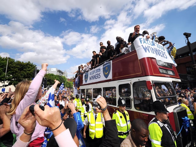 Fans showed their appreciation en route. Thousands of Pompey fans lined the streets of Portsmouth to watch, Portsmouth Football Club winners of the FA Cup 2008, parade the FA Cup through the streets. Picture: Allan Hutchings 082212-351