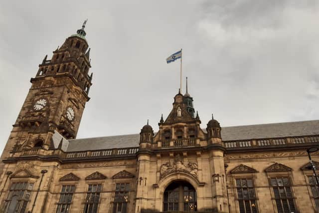 The Israel state flag flying over Sheffield Town Hall. It was later removed and replaced with a Palestine flag by protesters who climbed the building during a protest in solidarity with the people of Gaza. Picture: Julia Armstrong, LDRS