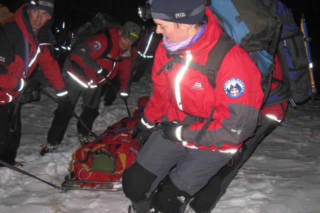Buxton Mountain Rescue Team recovering a casualty in snow on Kinder Scout.