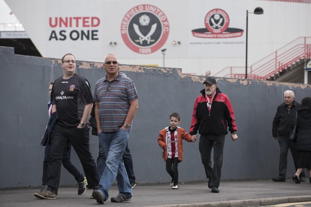 United fans walk to Bramall Lane before the Sky Bet League One match against Bradford City in April 2017.