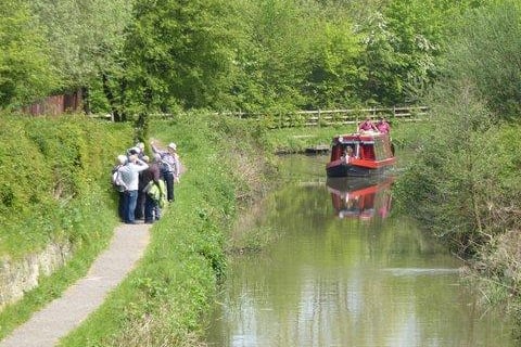 Carry on past two more locks to Hollingwood Hub, with a popular cafe and information point. One of two  trip boats operating on this section is moored here