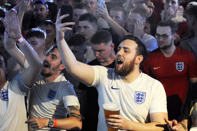 Jubilant England fans watching the World Cup quarter final win over Sweden at Walkabout Bar on Carver Street, Sheffield in July 2018