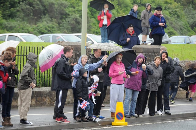 These spectators were hoping to catch a glimpse of the torch as it came through Whitburn.