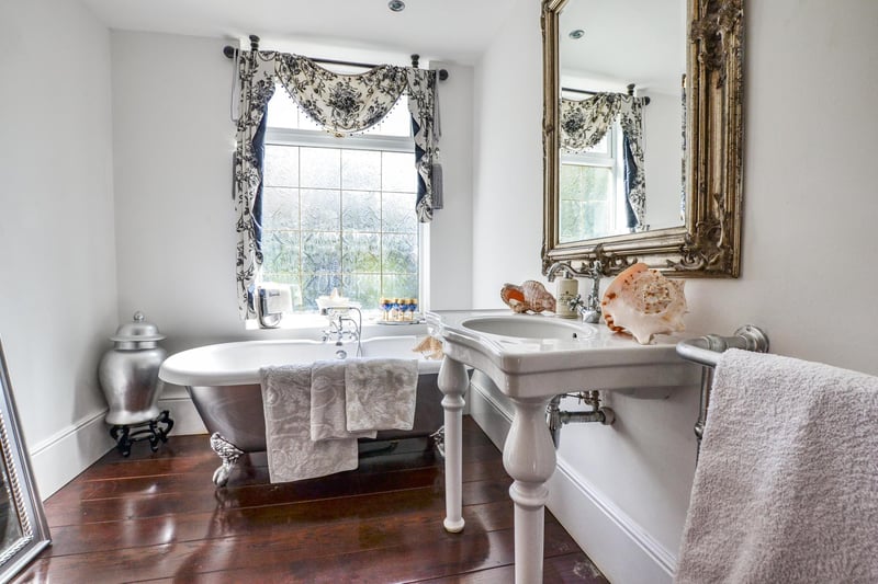 With a free standing bath, this family bathroom is stylish and practical.