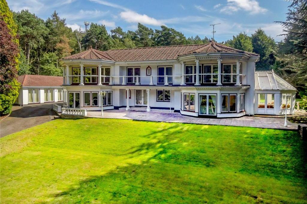 The glorious facade of Mount Charlotte at Newstead Abbey Park, which is on the market at a guide price of £1,750,000. It sits, elevated, in a stunning position, surrounded by mature pine trees.