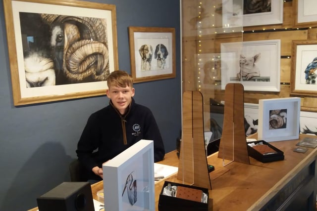 Matt Robson Artwork reopens to customers. Matt, 16, smiles for the camera.