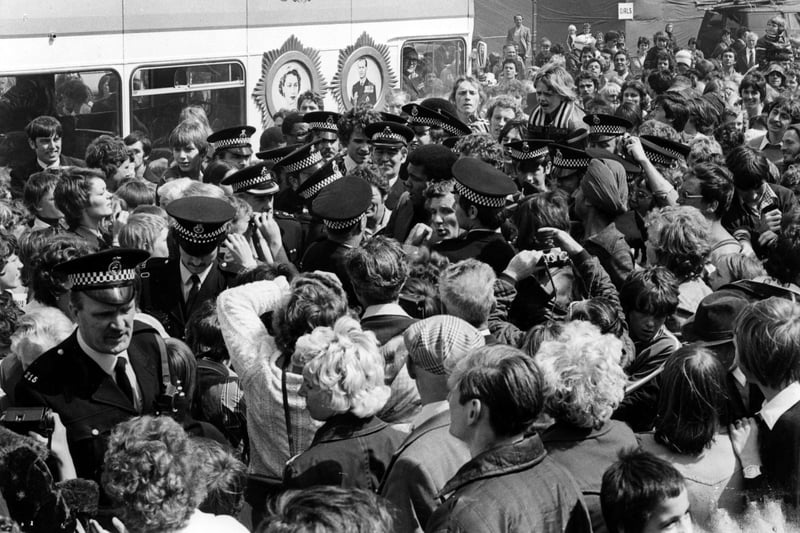 A packed and adoring crowd surrounds the champion. Can you spot someone you know? Photo: Photo: Freddie Muddit and thanks to www.southtynesidehistory.co.uk for their help.