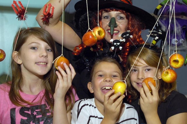 Halloween activities at Centre in the Park, Norfolk Park, Sheffield. Apple-bobbing is one of the games enjoyed. From left, Imogen Pass, Eliza Pass, Alice Corris, and at the back, Frances Pass, October 2010