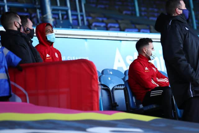 Jayden Bogle of Sheffield Utd and George Baldock watch from the stands after being withdrawn: Simon Bellis/Sportimage