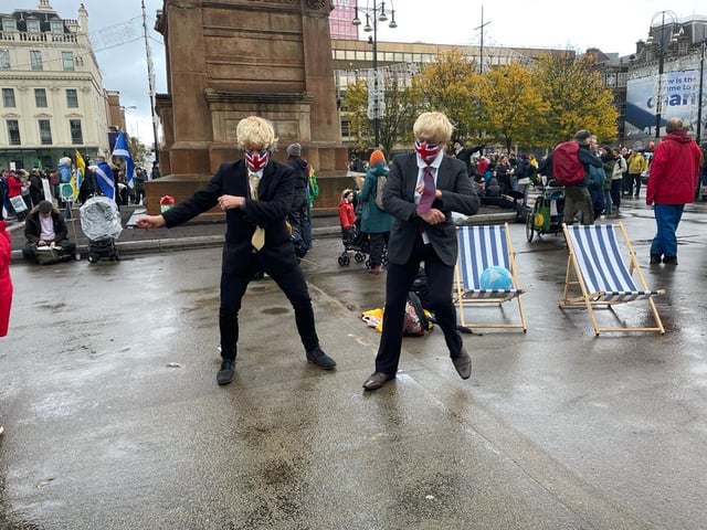 The activists dressed up as Boris Johnson doing some more dancing in George square.