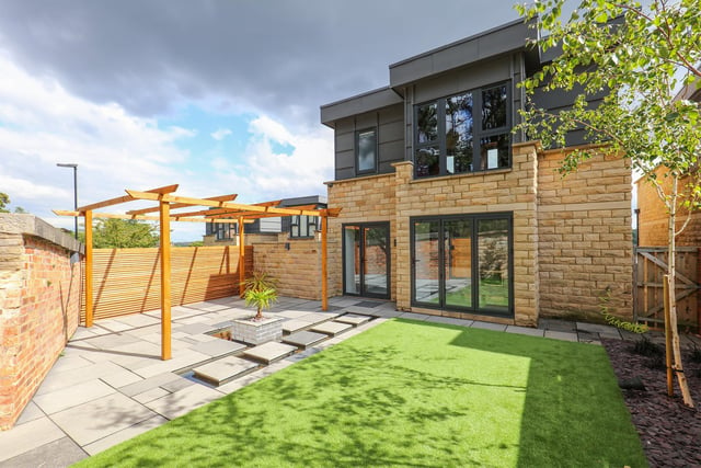 Outside there is a low-maintenance landscaped garden, accessible via patio doors.