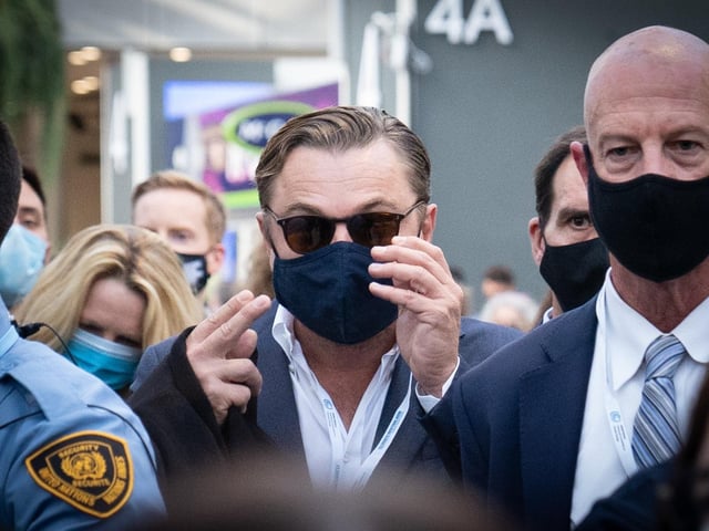 Leonardo DiCaprio walked through the exhibition hall at the Cop26 summit in Glasgow.