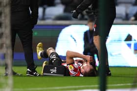 Rhys Norrington Davies of Sheffield United goes down injured at Coventry City: Darren Staples / Sportimage
