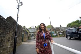 Headteacher Hannan Mohammed beneath the new CCTV cameras installed at Carfield Primary School in Meersbrook, Sheffield, to stop drivers parking dangerously close to the school gates (pic: Chris Etchells)