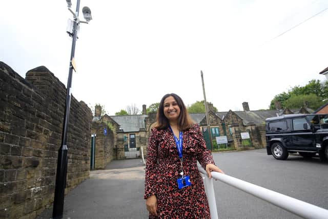 Headteacher Hannan Mohammed beneath the new CCTV cameras installed at Carfield Primary School in Meersbrook, Sheffield, to stop drivers parking dangerously close to the school gates (pic: Chris Etchells)