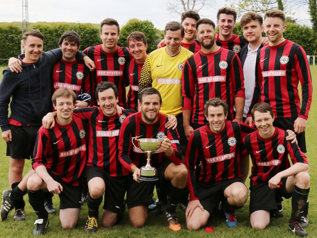 Dave Bridger holds the Len Den Cup as Carberry celebrate their 2-0 win over Horndean United, 2017. Picture: Kevin Shipp.