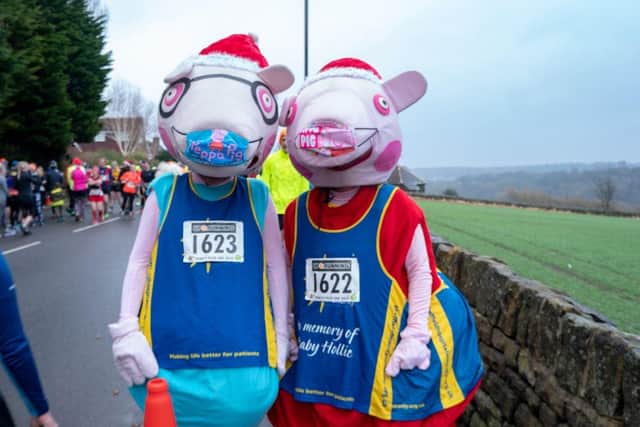 Runners including this duo dressed as Peppa Pig characters braved blustery conditions in the 28th edition of the Percy Pud 10K run. Picture by Andreea Popa