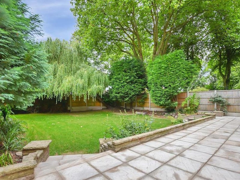 Back outside now, and a view of the recently-laid, raised patio at the back. The garden is deceptively large and also includes well-kept lawns.