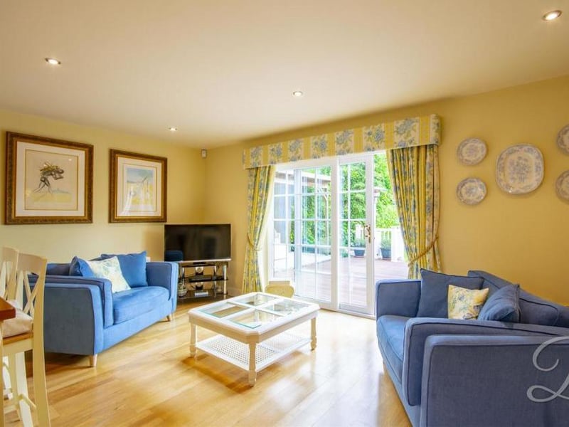 Even the kitchen diner has room to relax. Sliding doors lead to the front garden.