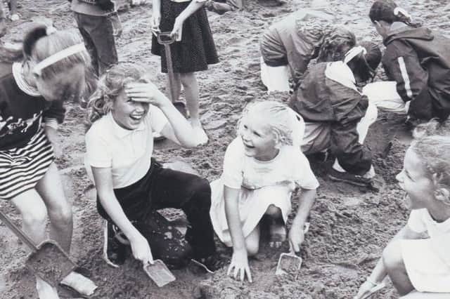 All smiles on the beach. Were you pictured at the dig 31 years ago?