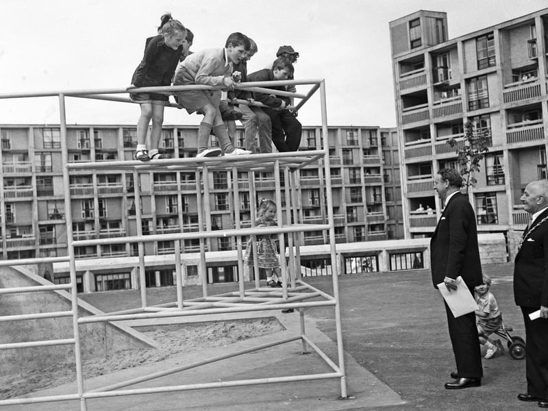Former Labour leader Hugh Gaitskell chats to children in the playground as he opens Sheffield's Park Hill Flats in 1961