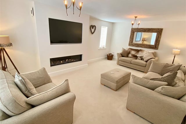 Lounge - A beautifully presented lounge with front and side facing double glazed windows. There is an inset which houses the contemporary style remote controlled gas fire and inset for a wall mounted TV.