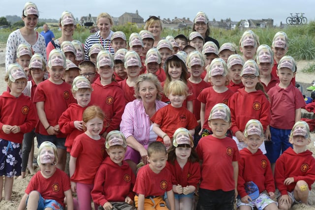 Where's Margaret?
Margaret Drummond, who retired after 20 years as nursery and reception teacher at Whittingham First School, in 2015, treated the whole school to a trip to Alnmouth Beach on the last day of term. Everyone wore masks in honour of her
