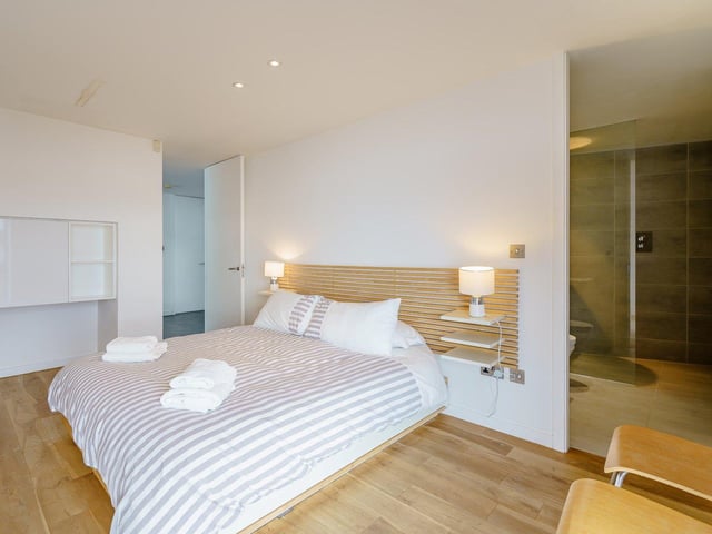 One of the five bedrooms, which has an en suite.