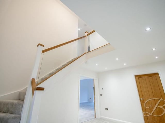 The hallway has built in storage cupboard and access to downstairs WC.