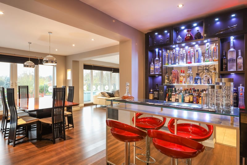 Enjoy a night out without leaving the house with this stylish bar area