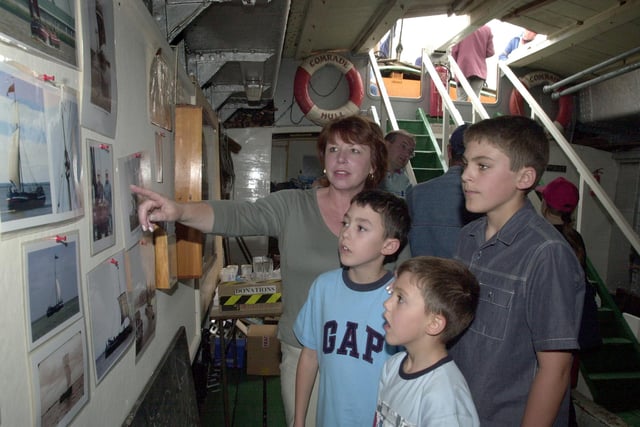 Water weekend on the canal, New Inn Stainforth.Inside the Humber Keel docked on the canal enjoying pictures from the past is Marion Berry with her Grandsons Thomas Berry, 11, Connor Berry, 9 and Nathan Berry, aged 6 in 2002