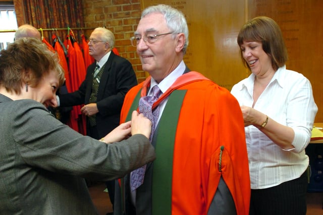 Sheffield artist Joe Scarborough is fitted with his robes before receiving his honorary degree in a graduation ceremony at the Octagon Centre, University of Sheffield in July 2008