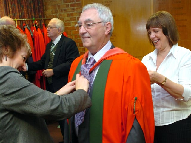 Sheffield artist Joe Scarborough is fitted with his robes before receiving his honorary degree in a graduation ceremony at the Octagon Centre, University of Sheffield in July 2008