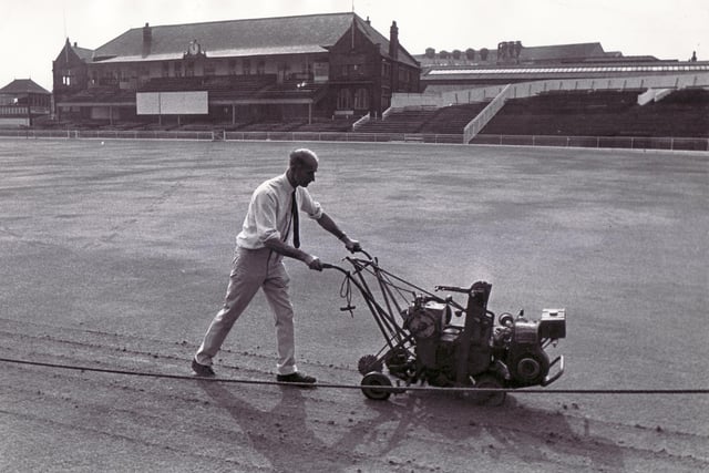 Eric Pope, of Pope Brothers Ltd, takes the cutting machine across the outfield in August 1973.