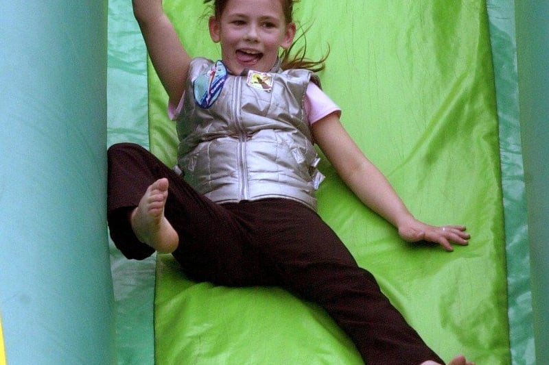 Enjoying the thrill of the inflatable slide at the Hillsborough Gala in 2001