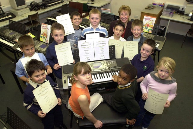 Youngsters who  passed their first junior exam at The Yamaha Music School, at Danum School Technolgy College's lower school, are pictured with music teacher Barbara Twigg. The young musicians are, clockwise, starting with Gemma Boothroyd (seated, centre left), aged eight, Daniel Reader, Mark Allen, both aged seven, William Newman, aged eight, Jozsef Taylor, aged nine, Sam Johnson, aged eight, Chritian Zammuto, Harry Murray, both aged nine, Joseph Arrowsmith, aged seven, Kira Drabble, aged eight, and Luke Watson, aged seven.