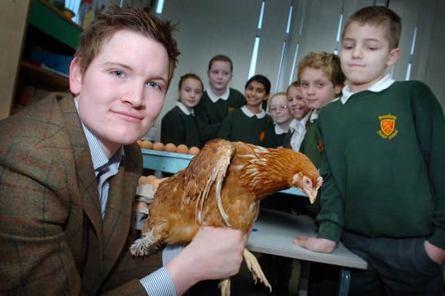 Farmer Chris Dickinson visits pupils at Broadway Junior School with Hetty the hen as part of the school's Farmhouse breakfast week. Remember this from 2011?